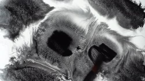 Ink Brush Applies Black Paint to Canvas