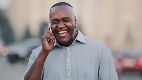 African American Businessman Standing on Street in Downtown Holding Smartphone Black Male
