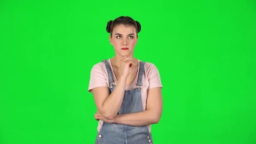 Young Girl Thinks About Something, and Then an Idea Comes To Her Against Green Screen