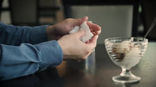 Hand Disinfection in a Cafe Before Eating