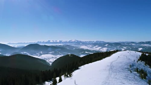 Aerial - Ski Lift at Ski Resort in Sunny Carpatian Mountains