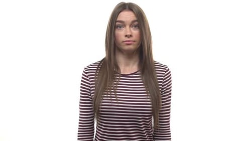 Woman Shrugs, Shows a Puzzled Expression on White