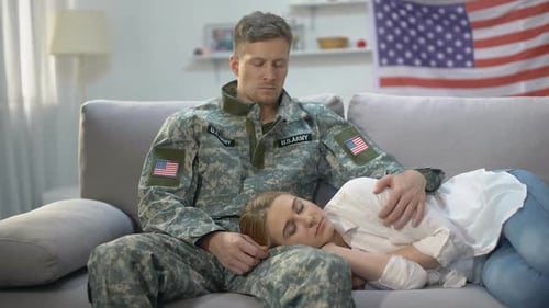 Soldier Comforting Sleeping Woman on Couch
