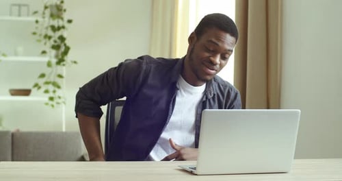 Man Working From Home on Laptop