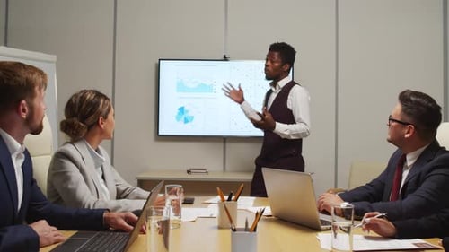 Enthusiastic Business Presentation in Modern Office