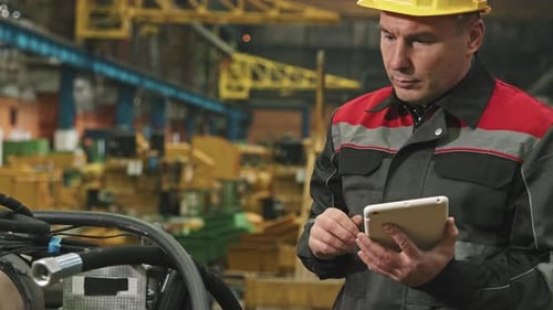 Male Plant Engineer With Digital Tablet