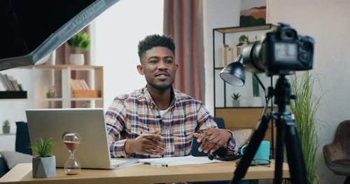 Man Records Video in Home Office Setup