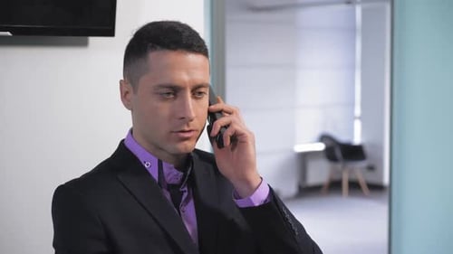 Professional Man Talking on Phone in Office