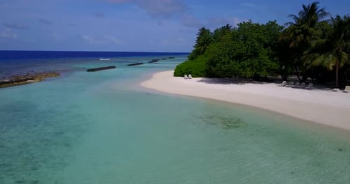 Tropical drone tourism shot of a sunshine white sandy paradise beach and turquoise sea background in