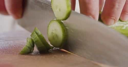 Cucumber Slice Preparation on Cutting Board
