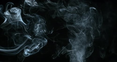 Abstract White Smoke Drifting on Black Background