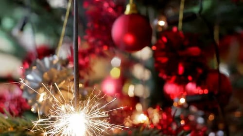 Sparkler Lights Near Decorated Christmas Tree Ornaments
