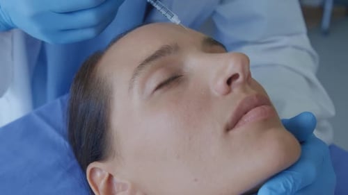 Young Woman Receives Injection in Medical Clinic