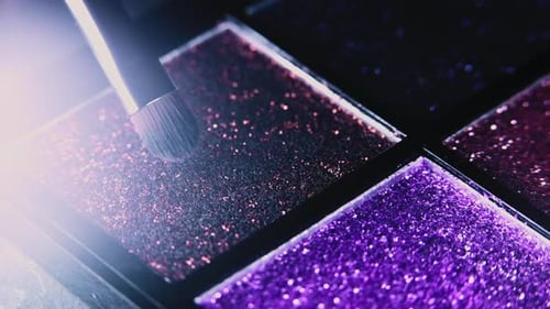 Macro View of Makeup Artist Working with Eyeshadow Sparkle Palette