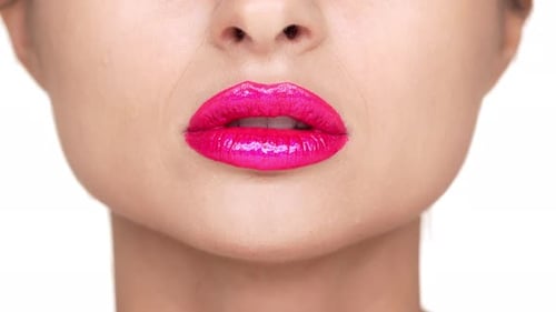 Extreme Close Up of Lips with Bright Lipstick