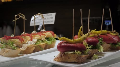 Showcase Window Display Assortiment with Tapas – Traditional Spanish Sandwiches in a Cafe in