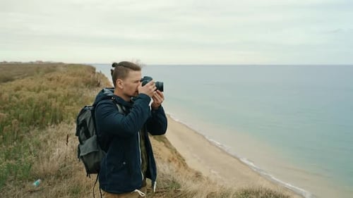 Photographer Taking Pictures of Ocean View