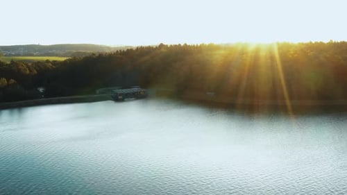 Incredible Sunset Nature, Drone Turning Right Over Calm Reflecting Autumn Lake, Green Forest and