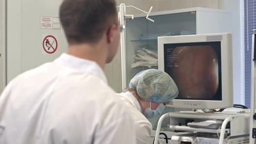 Doctor Looking at the Monitor During Endoscopic Surgery