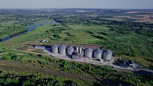 Grain Elevators on Green Nature Background