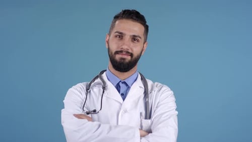 Smiling Doctor in White Coat on Blue Background