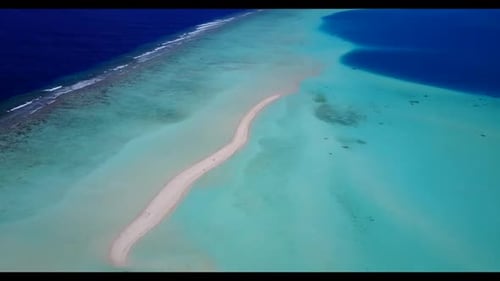 Aerial drone seascape of luxury seashore beach voyage by shallow lagoon with white sand background o