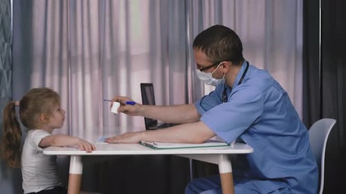 Doctor Gives Mask and Medicine To Little Girl in Hospital