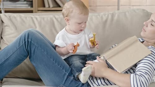 Cute Baby Playing on Sleeping Mother
