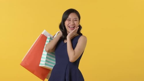 Woman with Shopping Bags Smiling and Gesturing
