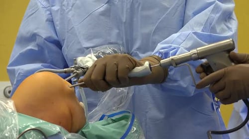 Surgeon Performing Arthroscopic Knee Surgery Procedure
