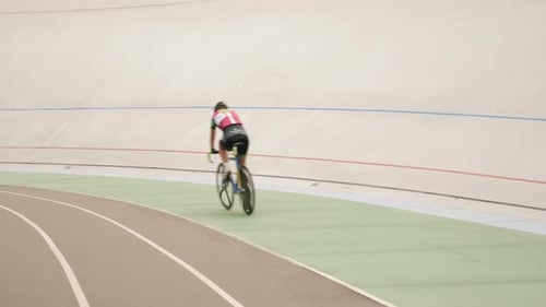 Velodrome. Cycling track. Group of competitive cyclists racing on track bike race on velodrome.