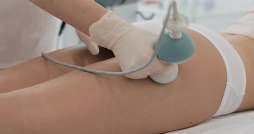 Buttocks Massage Performed by Aesthetician in Medical Setting