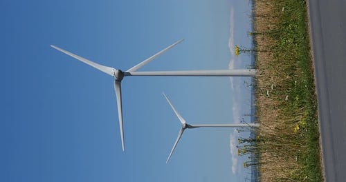 Wind Turbines with Blue Sky, near Caen in Normandy, Real Time 4K