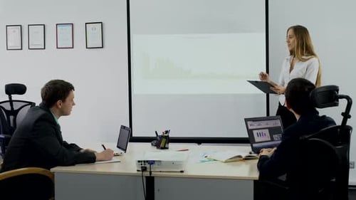 Business Meeting with Presentation in Modern Office