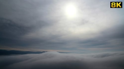 Scenic View of Mountains and Fog From Above