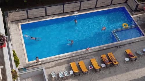 Happy young people relax in luxury resort on sunny day.