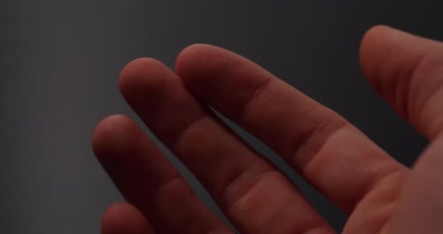 A human fingerprint glowing during scanning to protect a unique identity for a private access encryp