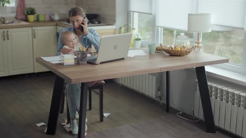 Beautiful Adult Woman Mother With Little Child Works Home