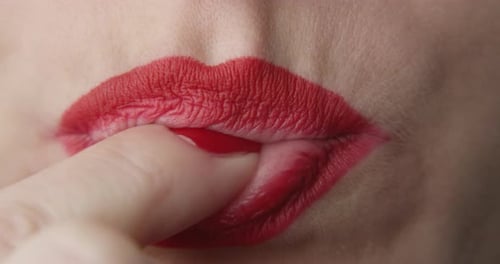 Woman Eating A Green Jelly Candy A Close Up Shot Of Red Lips And Nails