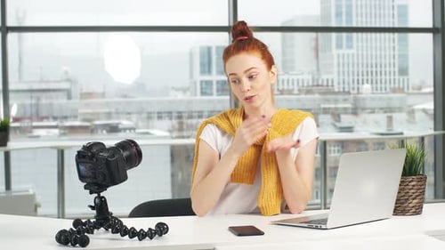 Woman Recording Video in Bright Office Setting
