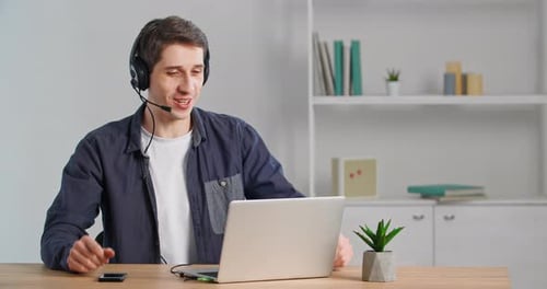Young Man Working From Home on Laptop