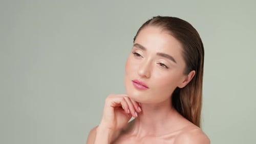 Gorgeous Woman Posing and Smiling on Plain Background