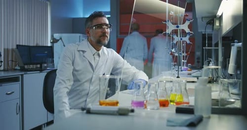 Scientist Using a Flat Transparent Display Screen