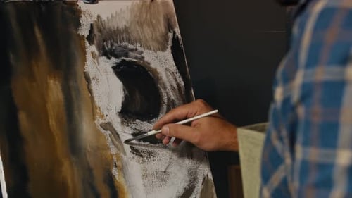 Artist Painting Abstract Art with Paintbrush