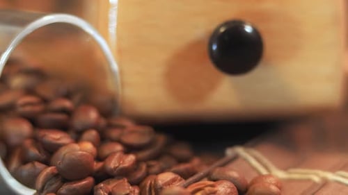 Coffee Beans and Wooden Grinder Close Up