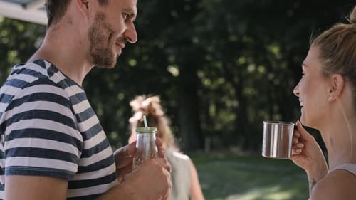 Handheld video of parents talking when children playing. Shot with RED helium camera in 8K.