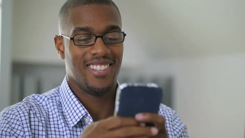 Businessman using mobile phone in office
