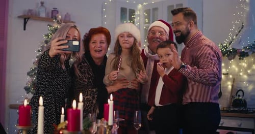 Family Posing for Christmas Selfie at Home