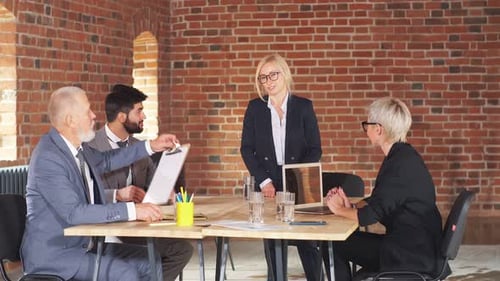 Business Meeting in Modern Loft Office Space