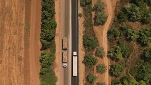 Truck loaded with Shipping container on a rural highway.